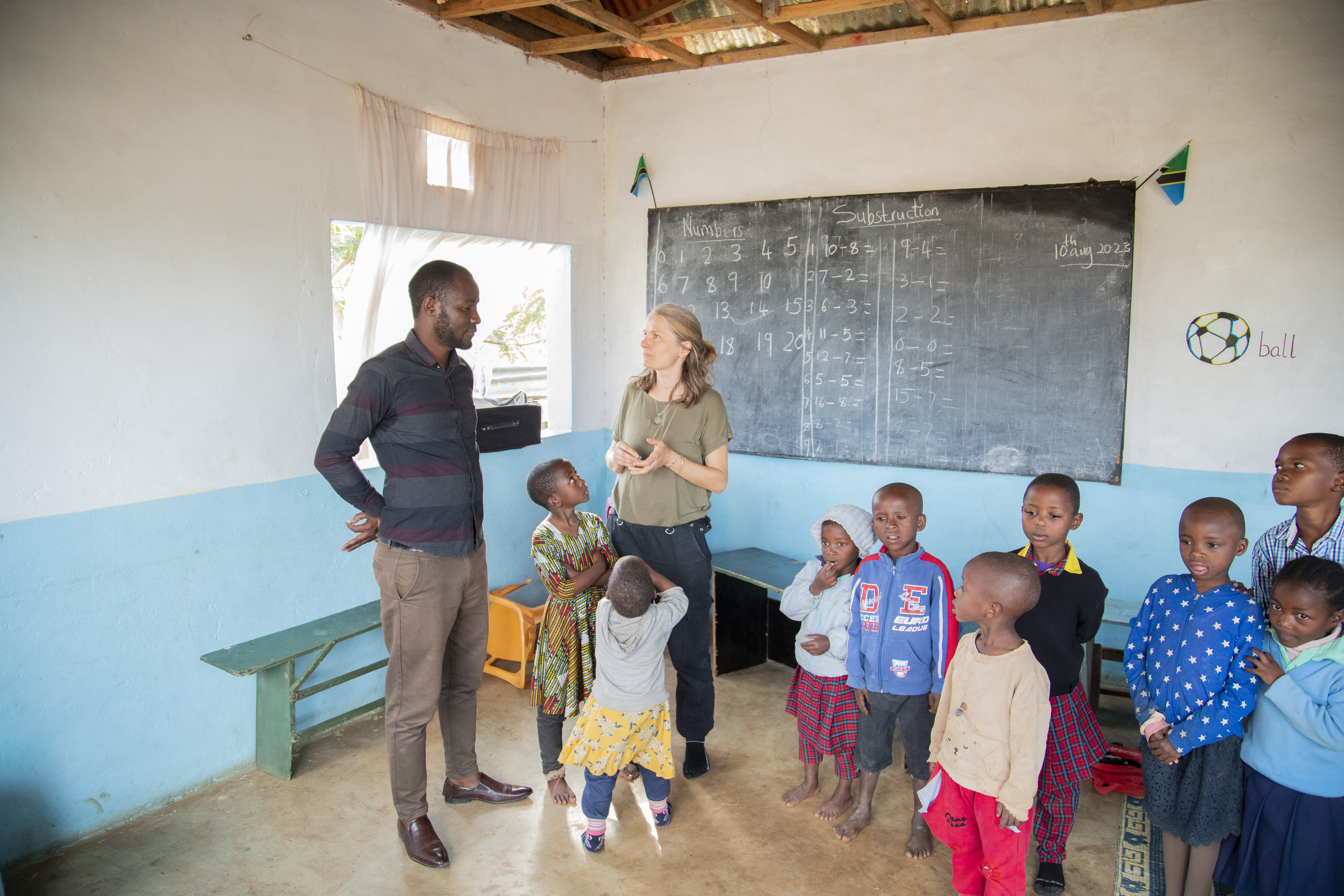Happy students and teacher in a school in Africa